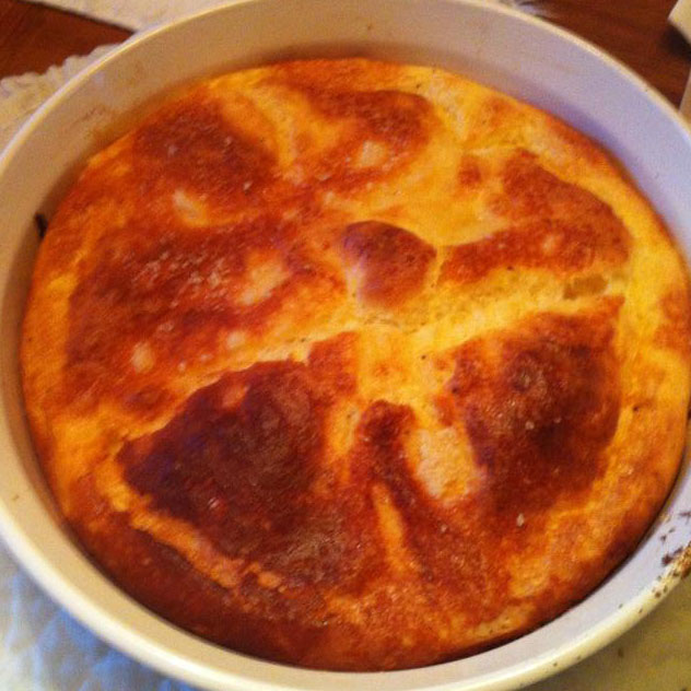 [photo of a cheese souffle in its dish]